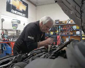 mechanic working at car