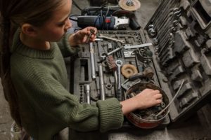 mechanic looking at car tools